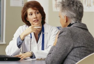 Mature female physician with PC